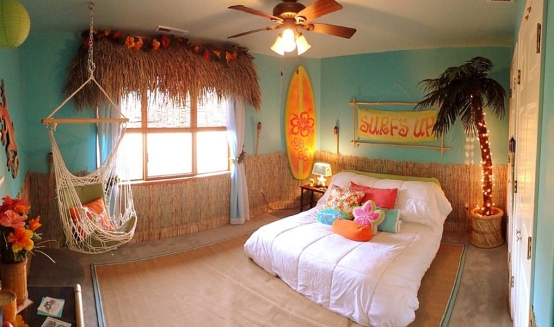 Hanging Rope Chair and Surfboard Wall Art in a Playful Island Bedroom