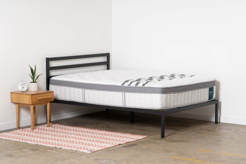 High-Profile Mattress on Low Wood Base in Minimalist Bedroom Layout