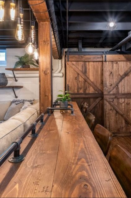 Home Bar with Wood Bar with Pipe Railing and Edison Bulbs