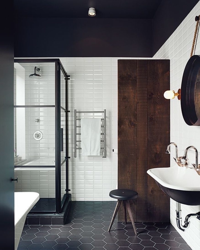 Industrial Bathroom Design with Black Hex Floor and Dark Wood Accent