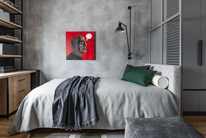 Industrial Bed against Grey Concrete Wall with Red Accent Art