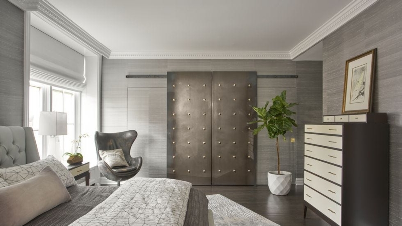 Industrial Bedroom Design: Metallic Sliding Doors & Grasscloth Wall