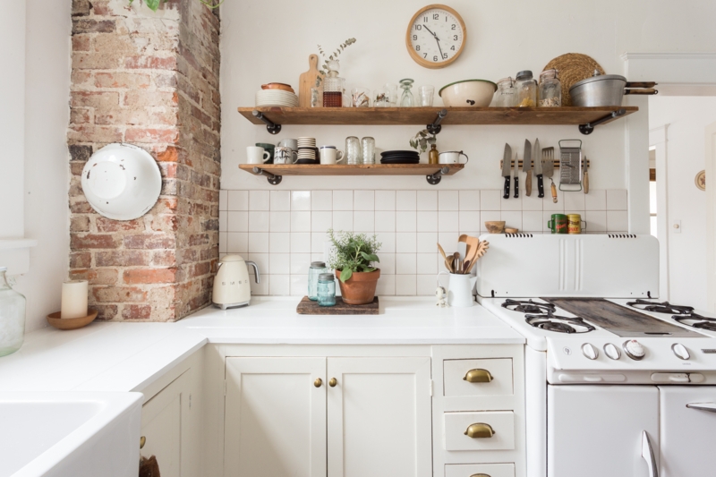 Industrial Pipe Shelf Kitchen Storage on an Exposed Brick Accent Wall