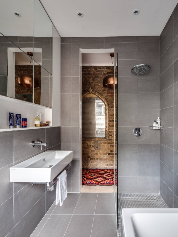 Industrial Style Bathroom with Exposed Brick and Floating Rectangular Sink