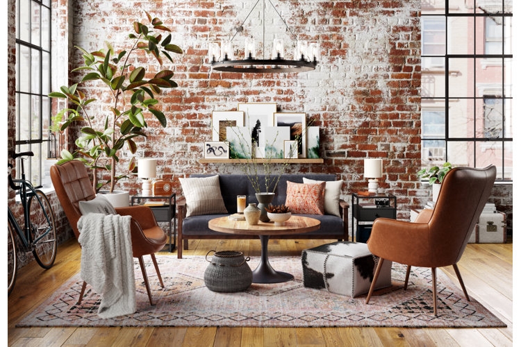 Industrial Style Living Room with Tan Leather Chairs and Brick Wall