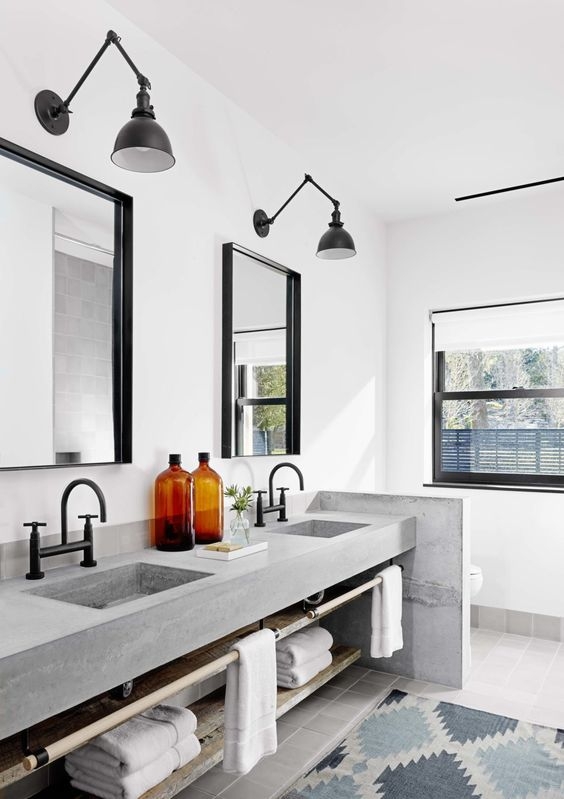 Industrial Vanity Design with Concrete Sinks and Swing Arm Lighting