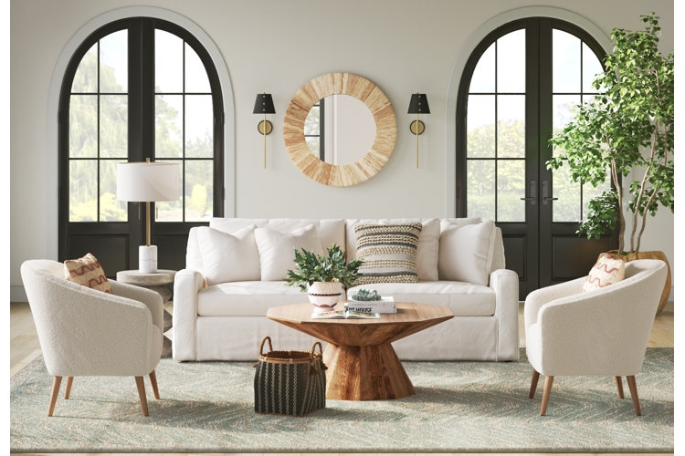 Ivory Boucle Accent Chairs Paired with a Geometric Wood Coffee Table