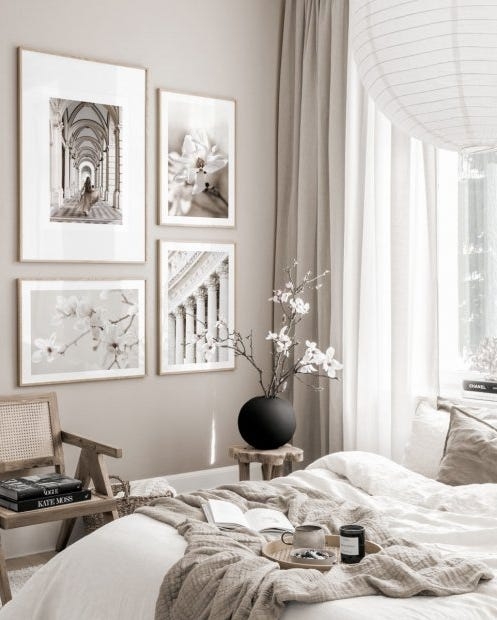 Japandi Style Bed with Cane Accent Chair and Monochrome Gallery Wall