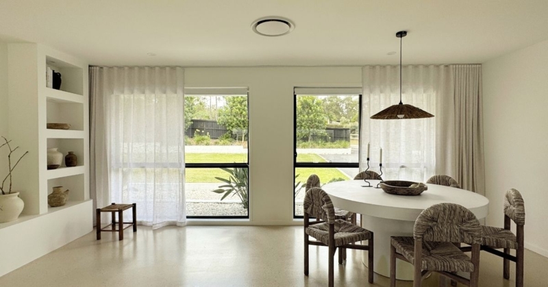Japandi Style Sheer S-Fold Curtains next to Built-in Wall Shelving