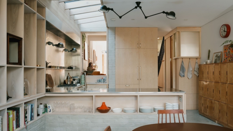 Kitchen Island with Stainless Steel Countertop under Skylight Lighting