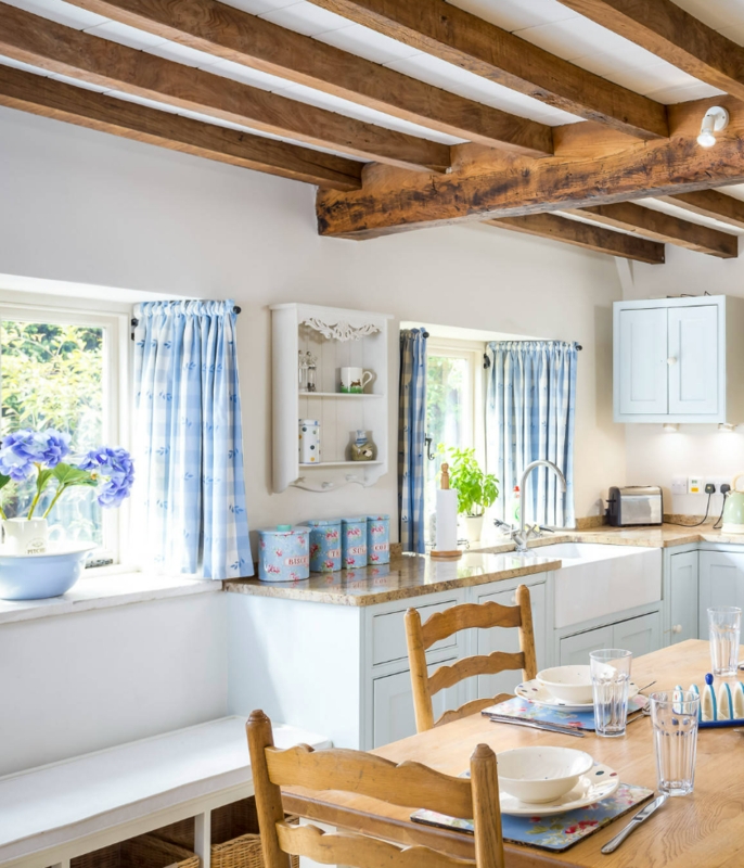 Kitchen: Rustic Space with Exposed Wood Beams & Blue Gingham Curtains