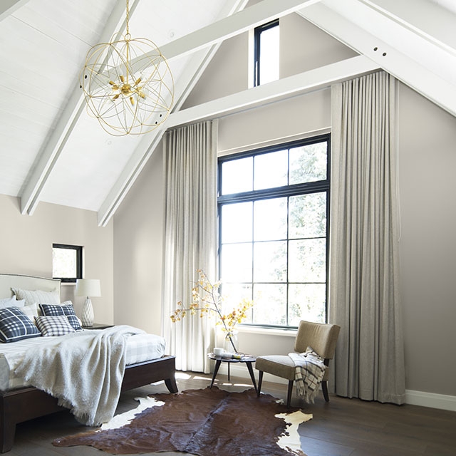 Large Gold Pendant Light in Vaulted Ceiling Bedroom Design