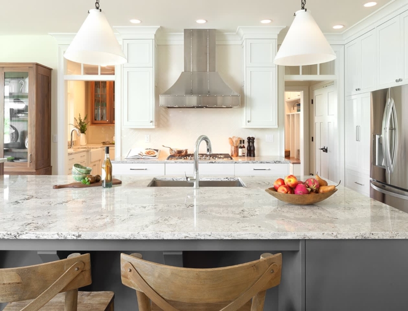 Large Marbled Stone Island Top and Oversized Pendants in Kitchen