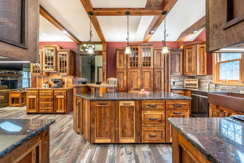 Large Rustic Kitchen Island with Stone Top and Exposed Beams