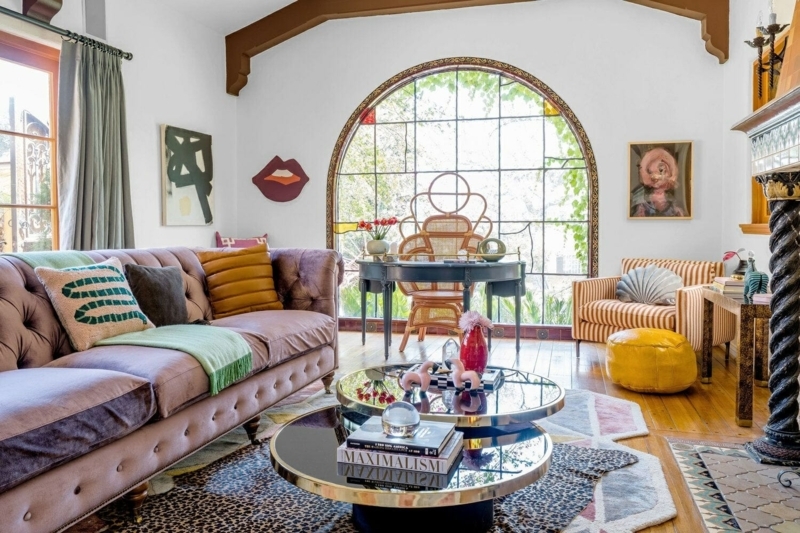 Layered Rug Styling with Leopard Print & Mauve Tufted Sofa
