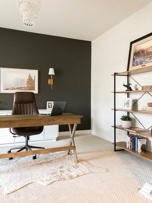 Layered Rugs under Writing Desk with X-Frame Base and Charcoal Wall