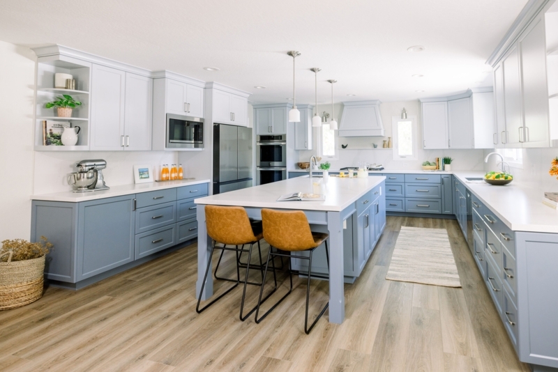 Light Blue and White Kitchen with Large Island and Camel Brown Stools