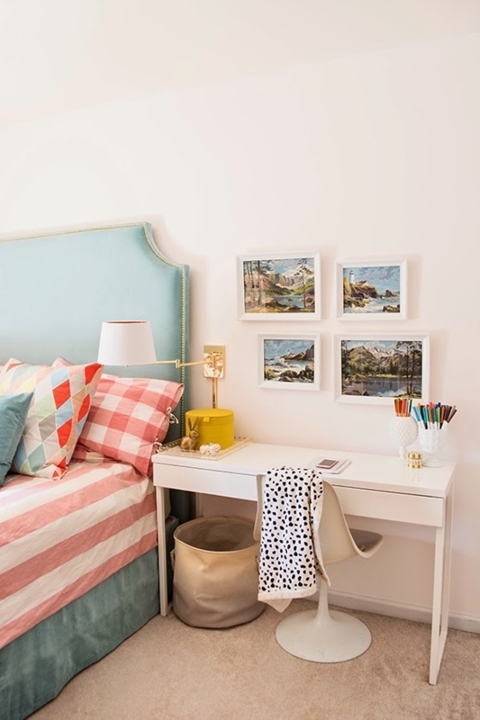 Light Blue Upholstered Headboard with Multi-Patterned Bedding