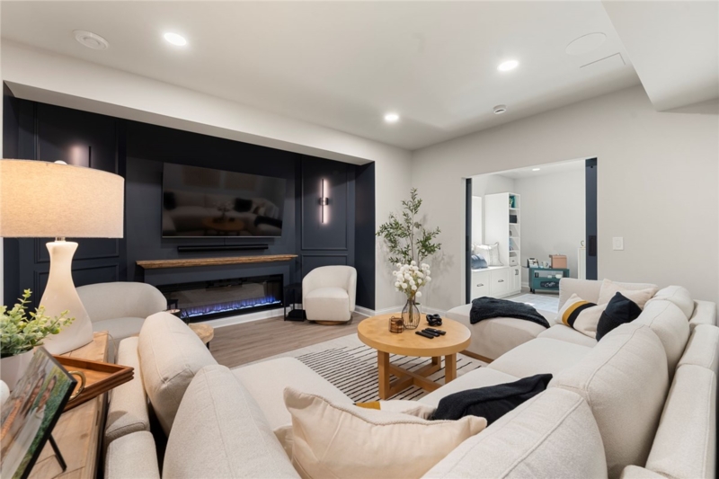 Linear Fireplace Wall Design in Navy Blue Basement Media Room