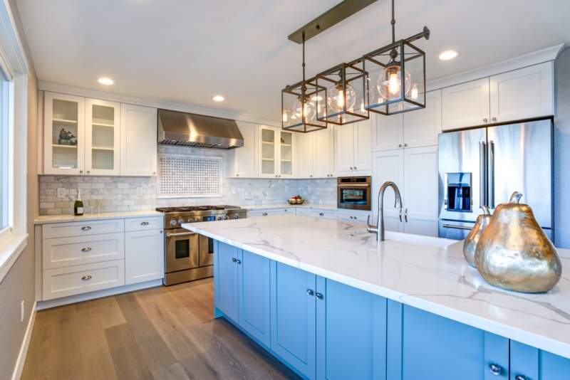 Linear Lantern Pendant Lighting for a Blue Kitchen Island Design