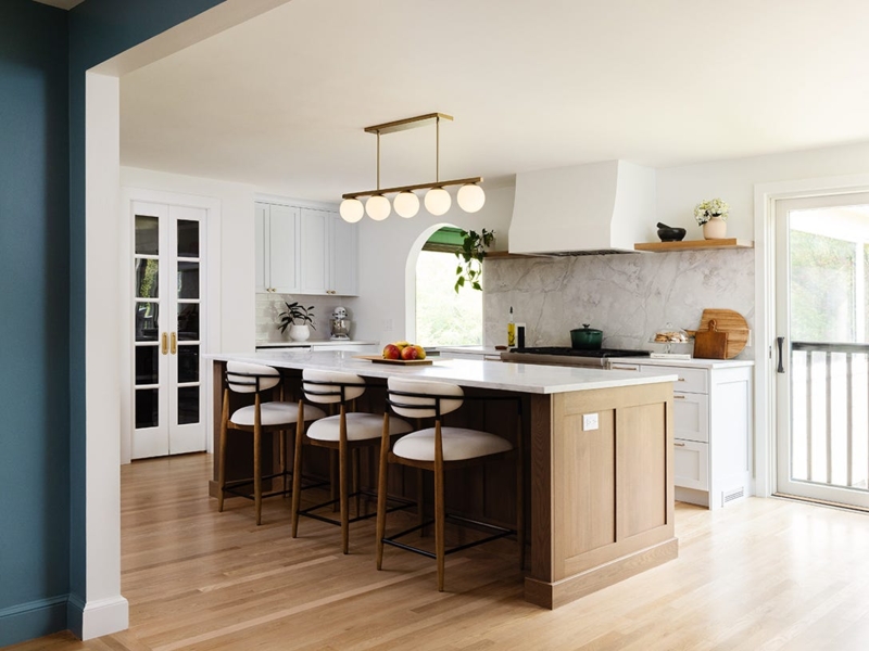 Linear Pendant Light Over Island in Kitchen with Arched Feature