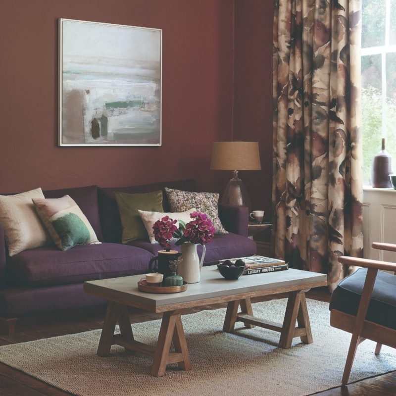 Living Room Deep Brown Walls Purple Sofa Trestle Table Moody