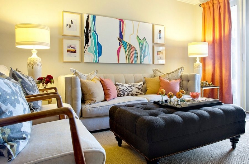 Living Room Eclectic Gallery Wall with Tufted Ottoman as Coffee Table