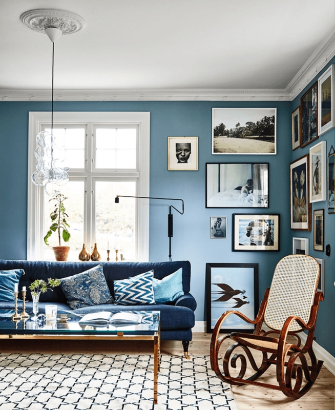 Living Room featuring Bentwood Rocking Chair and Blue Gallery Wall