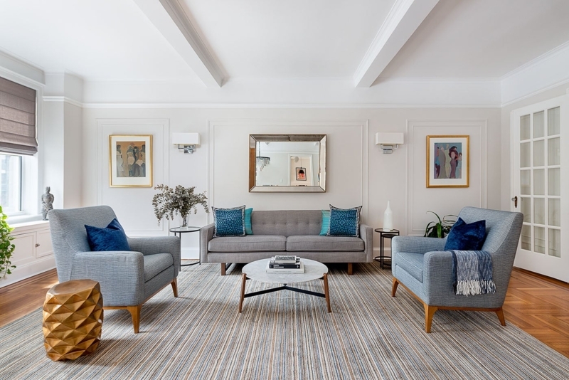 Living Room featuring Coffered Ceiling and Striped Area Rug