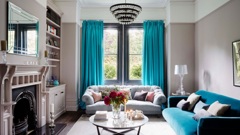 Living Room in Teal and Grey Palette with Tiered Crystal Chandelier