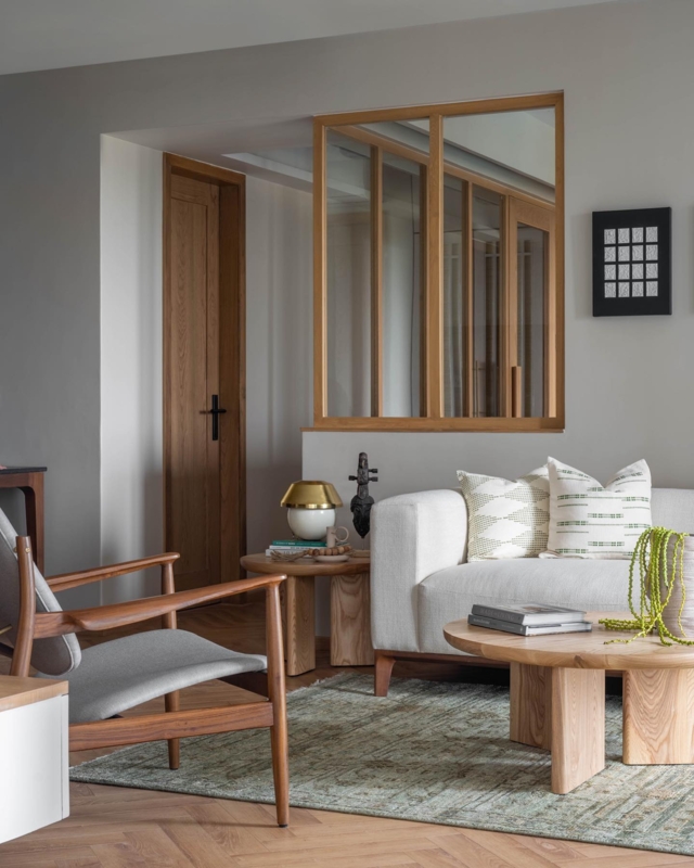 Living Room: Internal Glass Partition Wall Design with Chunky Leg Table.