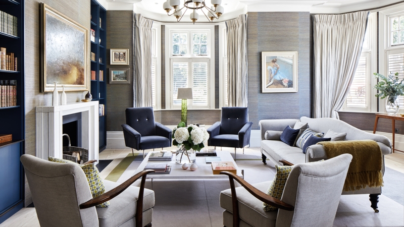 Living Room with Blue Built-In Bookshelves and Fireplace