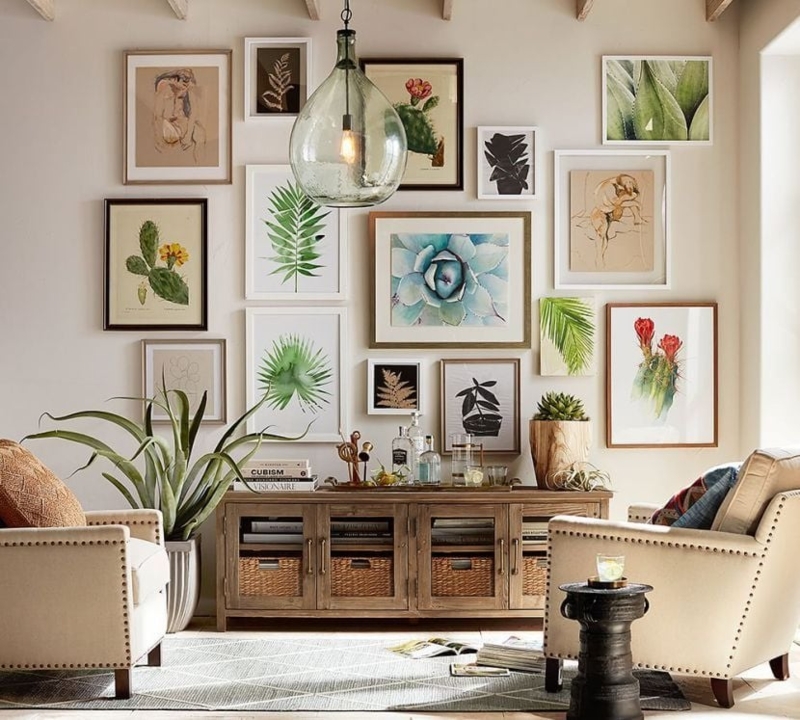 Living Room with Botanical Gallery Wall and Oversized Glass Pendant