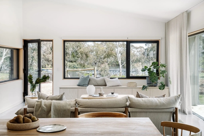 Living Room with Built-In Window Bench Storage and Black Frames