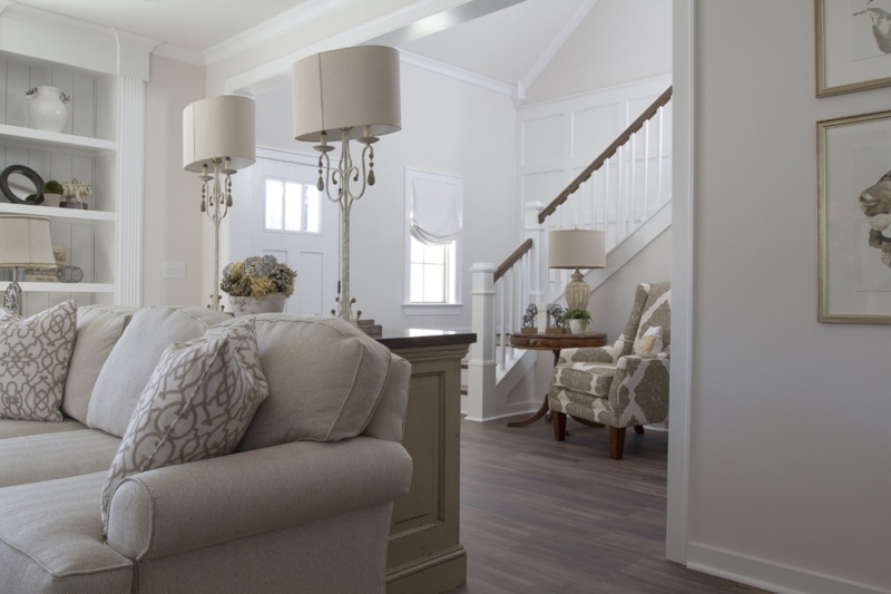 Living Room with Ornate Twin Lamps & White Paneled Wainscoting Decor