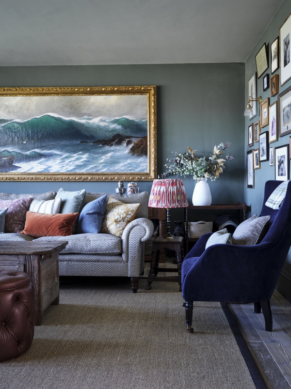 Living Room with Oversized Wave Painting and Navy Velvet Wingback