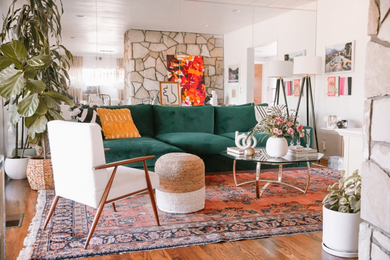 Living Room with Stone Fireplace Wall & Emerald Velvet Sectional