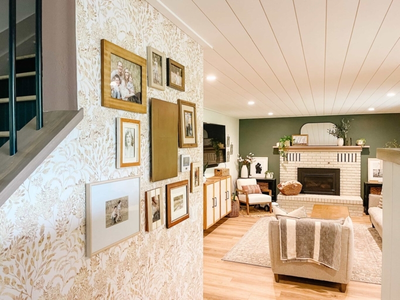 Living Room with White Brick Fireplace and Green Accent Wall