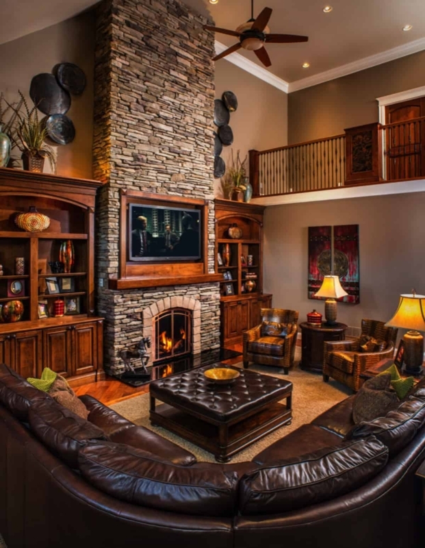 Lodge Style Living Room With Floor-To-Ceiling Stone Fireplace