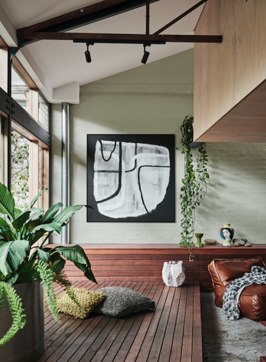Lounge with Slatted Wood Platform Floor and Exposed Ceiling Beams