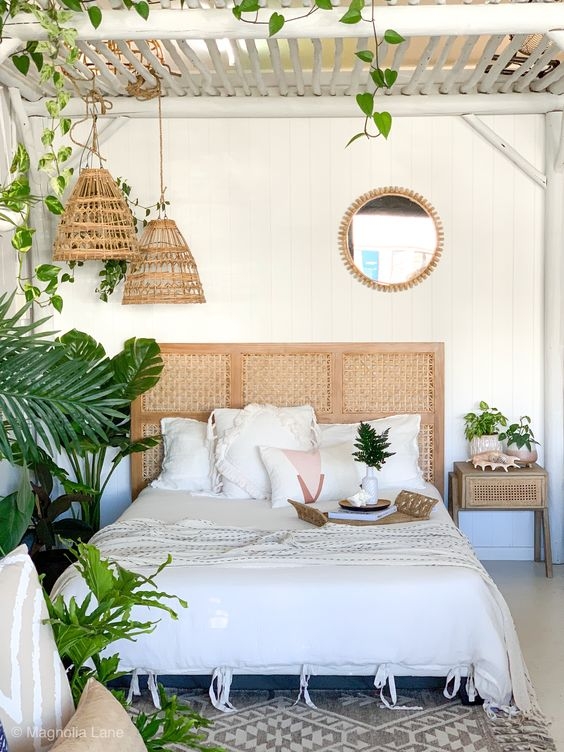 Lush Indoor Greenery and Exposed Beams in a Boho Chic Bedroom