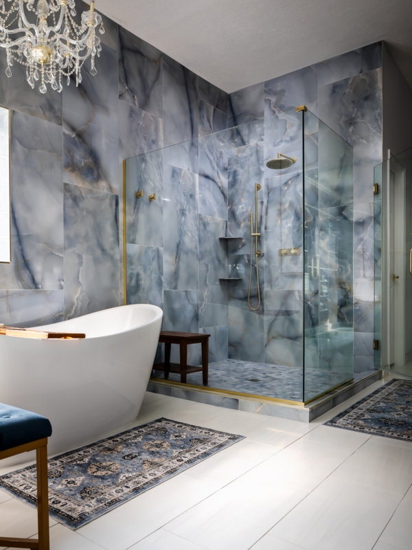 Luxury Freestanding Tub with Blue Onyx Wall Tile and Gold Fixtures