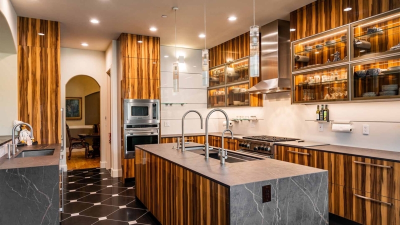 Luxury Kitchen with Vertical Grain Cabinets and Backlit Glass Shelving