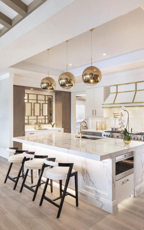 Luxury White Kitchen with Marble Island and Under-Cabinet Lighting