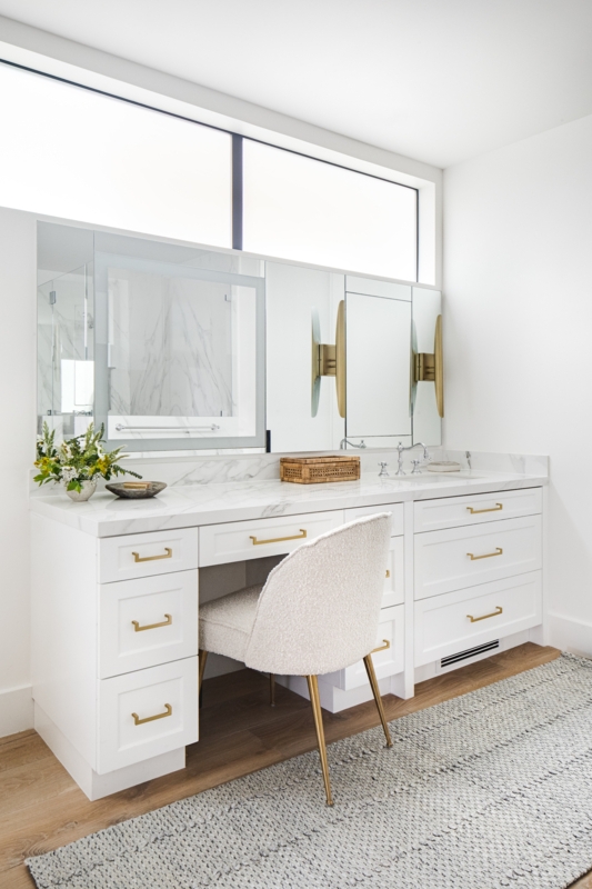 Makeup Vanity with Boucle Chair and Gold Hardware in a Dressing Room