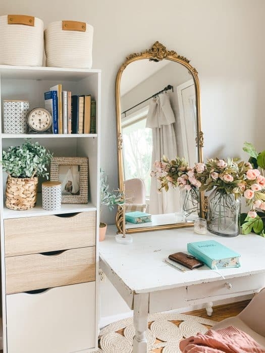 Makeup Vanity with Ornate Arched Gold Mirror and Woven Storage