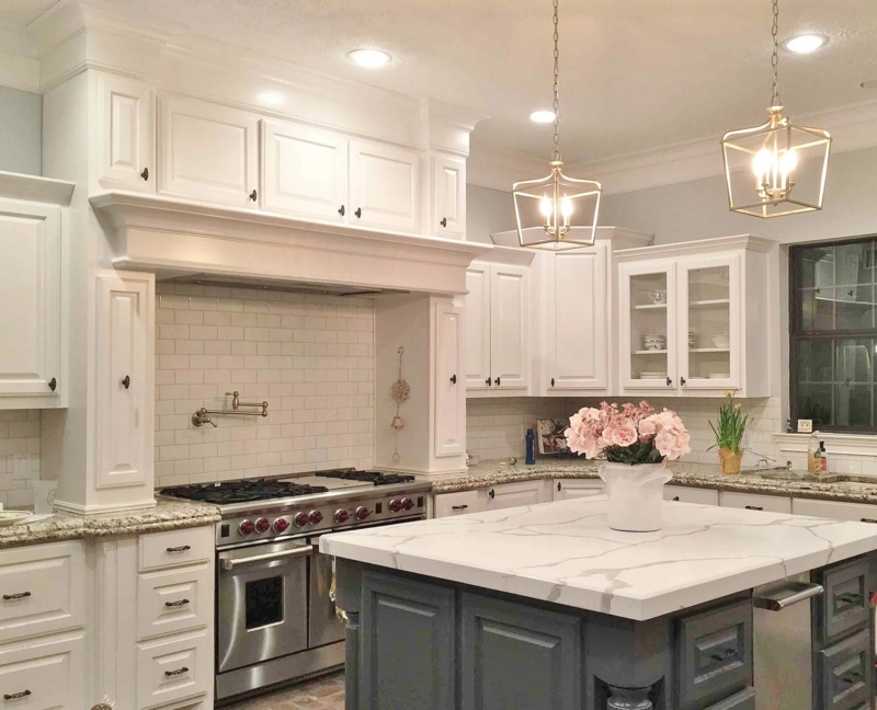 Marble Look Island with Brass Lantern Lights in White Shaker Kitchen