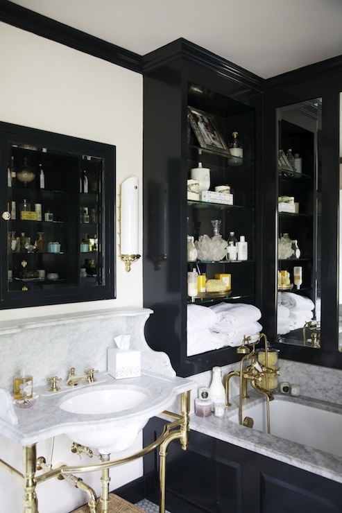 Marble Washstand with Brass Legs in an Eclectic Cabinetry Bathroom