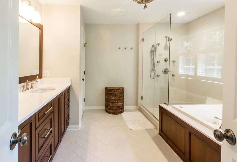 Master Bathroom Layout with Herringbone Tile Floor and Glass Shower