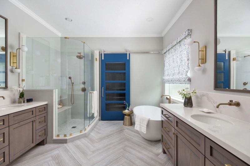 Master Bathroom with Blue Barn Door and Herringbone Floor